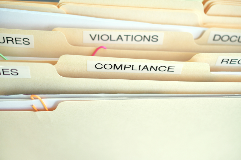 Risk management folders with violations and compliance for National Safety Month